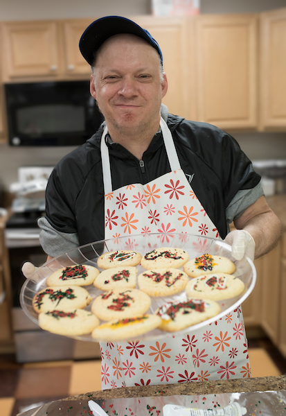 Man with tray of cookies