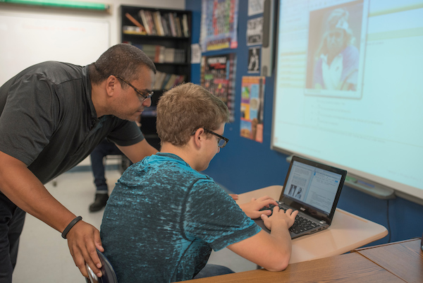 teacher student with chromebook