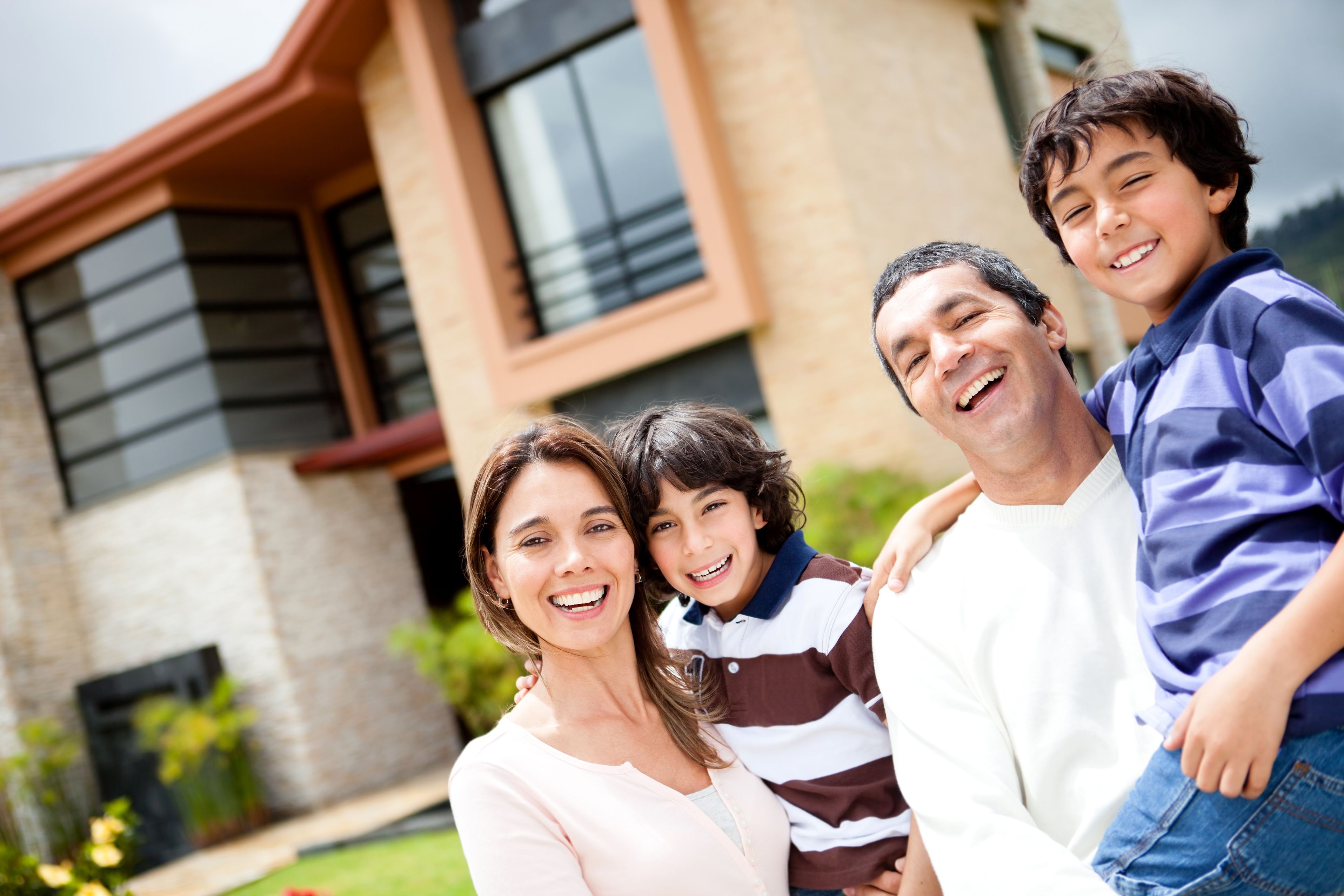 Family in front of house