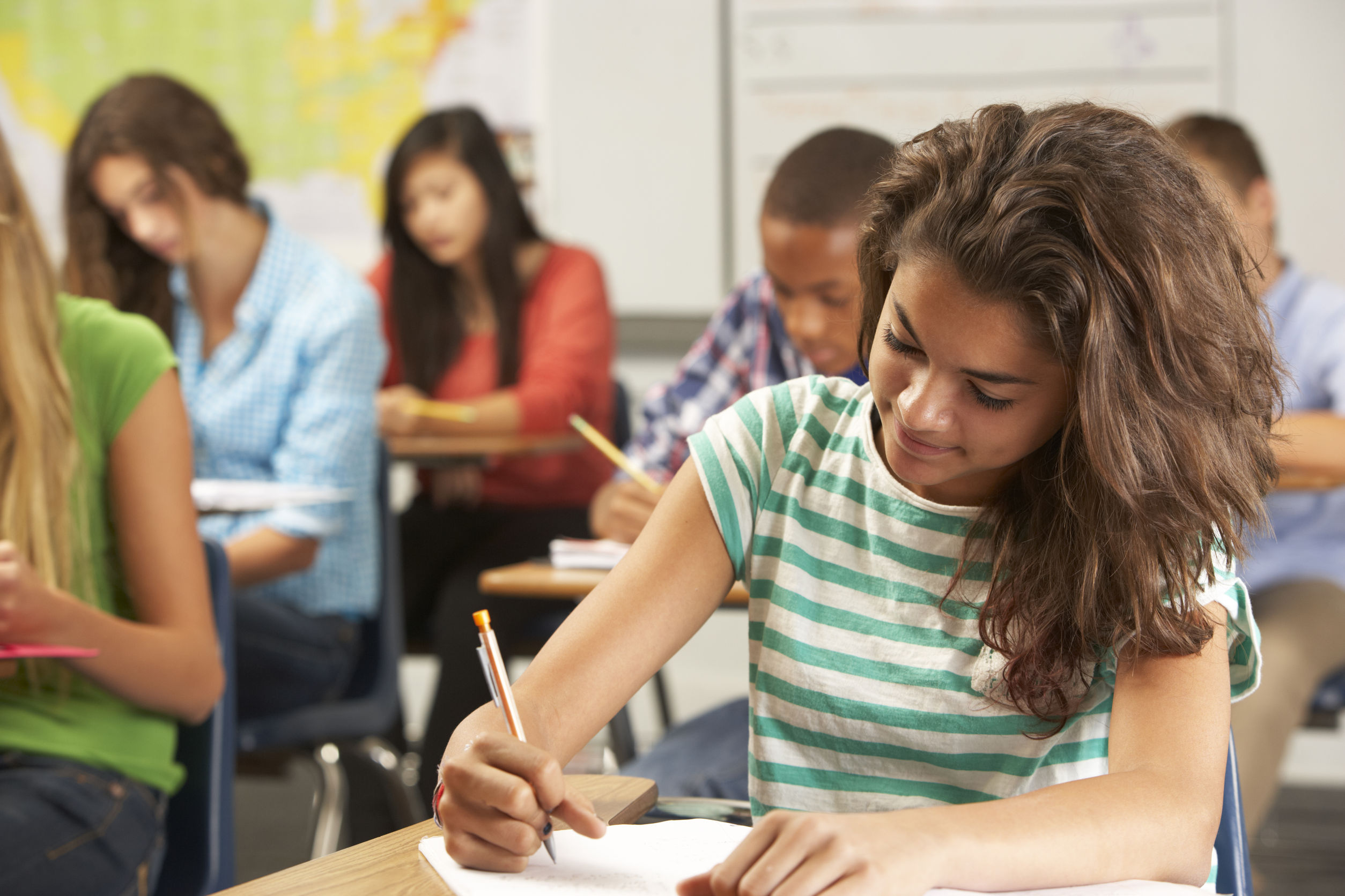 young female sitting at a desk