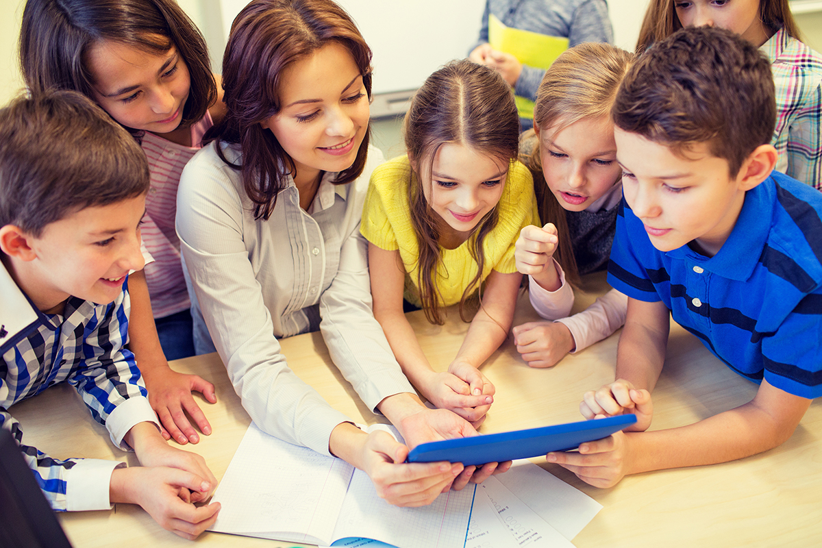 Children learning on tablet