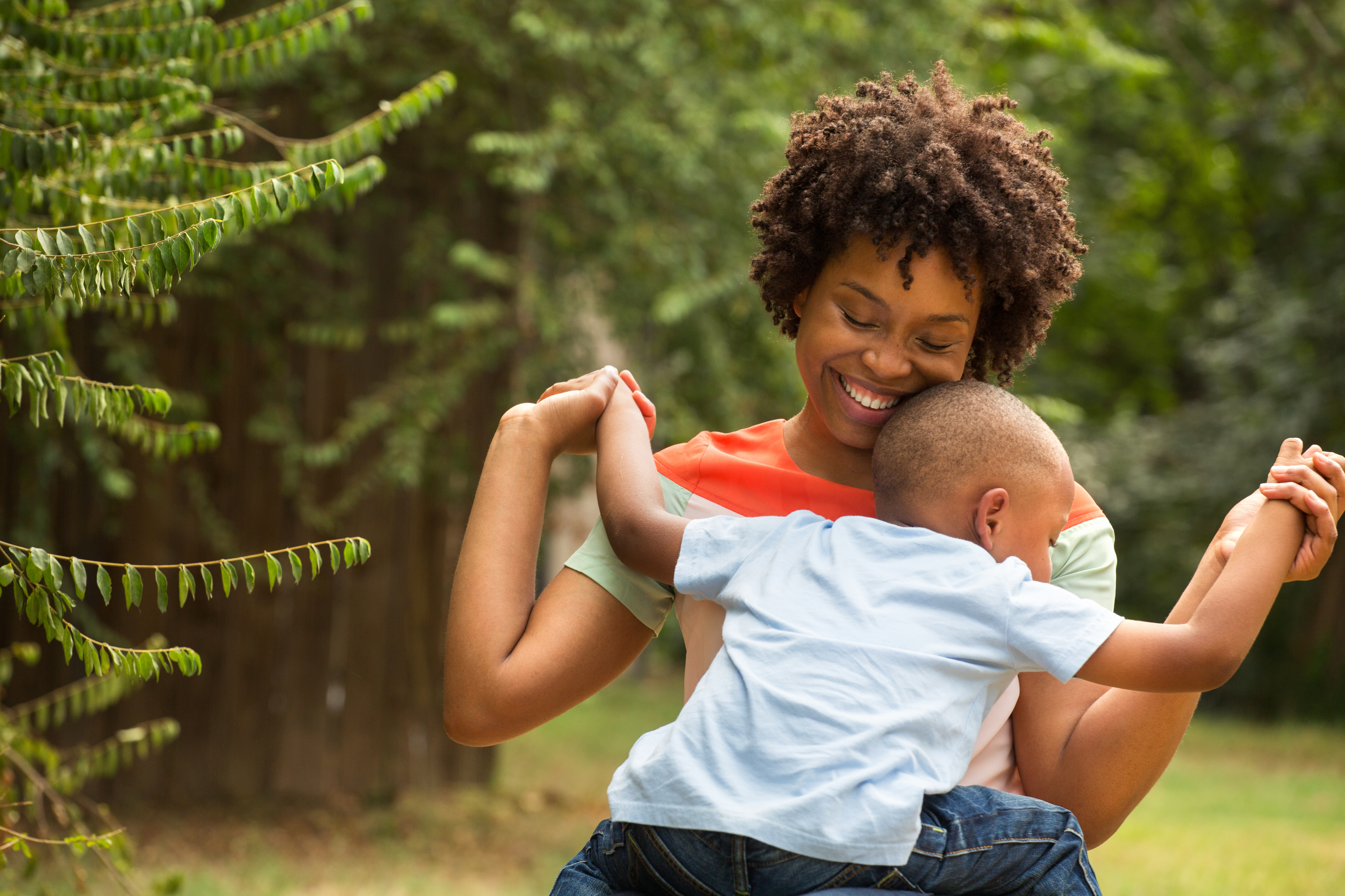 African American Mother holding her son