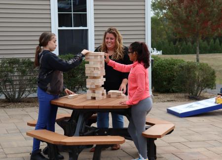 Students and staff playing Yahtzee at Meadowridge